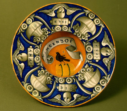 Broad-rimmed bowl with border of urns and cherubs' heads; in the center, device of a bird standing on a bundle with the inscription VINCENZO